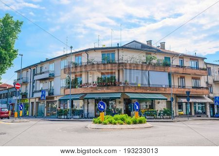 PADOVA, ITALY - May, 24, 2017: Flower-pot infront of inhabitable house in Padova, Italy
