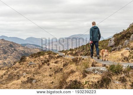 Man And Dog On Torc Mountain