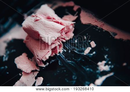 Ice cream roll fried in the fridge freezer pan on the street in Thailand fresh cooking made from fresh strawberries milk blueberries. Concept of tourist delicacy.
