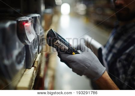 Scanning machine held by warehouse dispatcher
