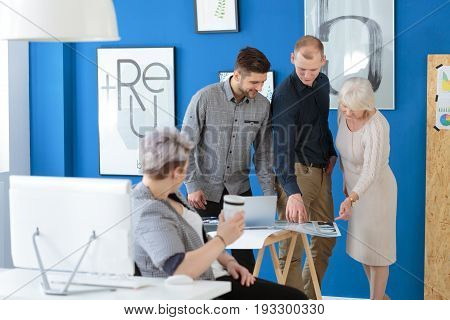 Group of employees in training having a meeting with their supervisor