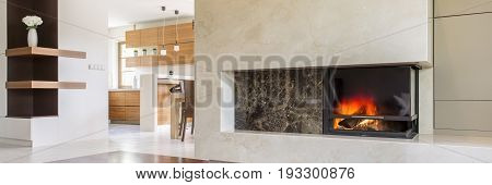 Close-up of cozy interior with burning fireplace
