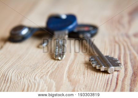 Keys Ring Bunch On Wood Texture Background.