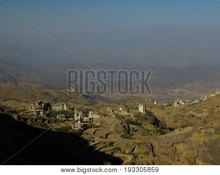 View to Manakha fortress and old city and terrace farming in Yemen