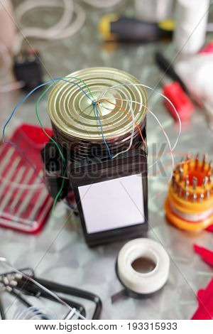 Close up of an improvised homemade bomb explosive device in blurred background.