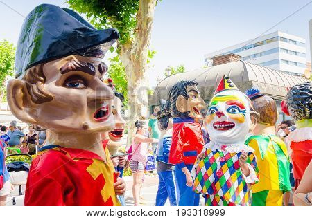 Badajoz, Spain - june 24, 2017: Disguised figures known as giants and big heads,  roughly gigantes y cabezudos parade for the children in the city of Badajoz