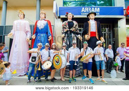 Badajoz, Spain - june 24, 2017: Disguised figures known as giants and big heads,  roughly gigantes y cabezudos parade for the children in the city of Badajoz