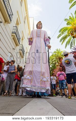 Badajoz, Spain - june 24, 2017: Disguised figures known as giants and big heads,  roughly gigantes y cabezudos parade for the children in the city of Badajoz