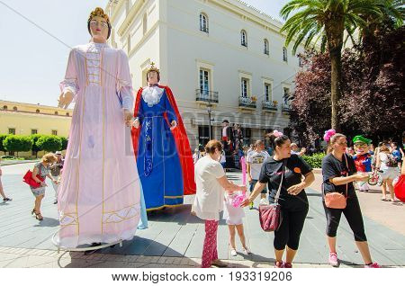 Badajoz, Spain - june 24, 2017: Disguised figures known as giants and big heads,  roughly gigantes y cabezudos parade for the children in the city of Badajoz