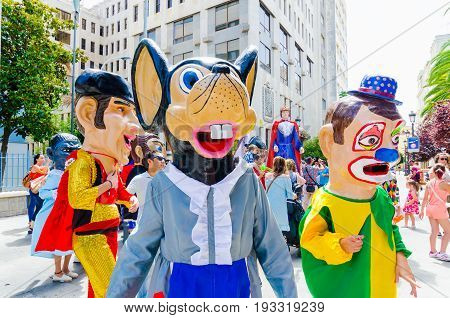 Badajoz, Spain - june 24, 2017: Disguised figures known as giants and big heads,  roughly gigantes y cabezudos parade for the children in the city of Badajoz
