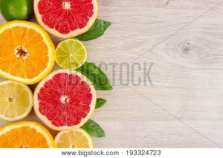 Juicy Citrus Fruits Cut Background Mint Leaf. Oranges, Lemons, Limes, Grapefruit, Mint Leaves On A B