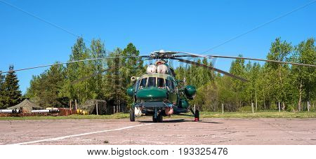 Multipurpose helicopter Mi-8 MT at the airfield in Pushkin during the festive Airshow. Helicopter in camouflage coloring.