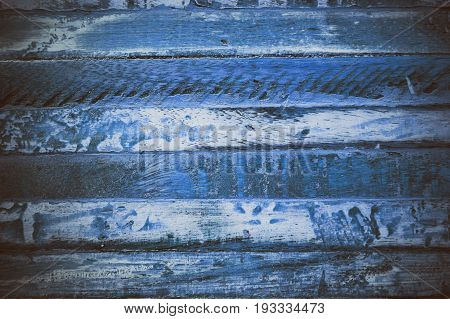Blue wooden abstract texture. Blue vintage wood background. Abstract texture and background for designers. Macro view of blue wood in vintage style. Blue wood background.