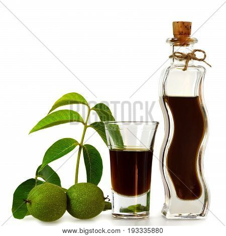 Homemade walnut liqueur isolated on white background