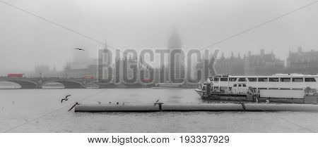 London River Thames Westminster riverscape during foggy weather on a partly de-saturated background