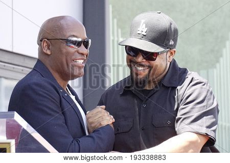 LOS ANGELES - JUN 12: John Singleton, Ice Cube at a ceremony as Ice Cube is honored with a star on the Hollywood Walk of Fame on June 12, 2017 in Los Angeles, CA