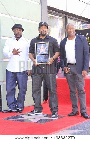 LOS ANGELES - JUN 12: William Loshawn Calhoun Jr aka WC, Ice Cube, John Singleton at a ceremony as Ice Cube is honored with a star on the Hollywood Walk of Fame on June 12, 2017 in Los Angeles, CA