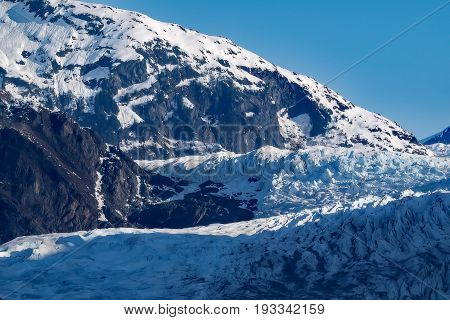 Mendenhall Glacier flowing down at Alaska's Inside Passage