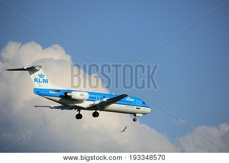 Amsterdam the Netherlands - May 20th 2017: PH-KZI KLM Cityhopper Fokker F70 approaching Schiphol Polderbaan runway