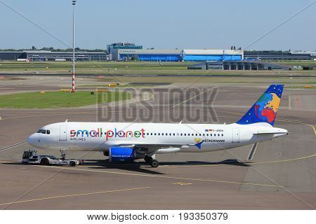 Amsterdam The Netherlands - May 26th 2017: D-ABDB Small Planet Airlines Germany Airbus A320 pulled back from the gate at Schiphol International Airport