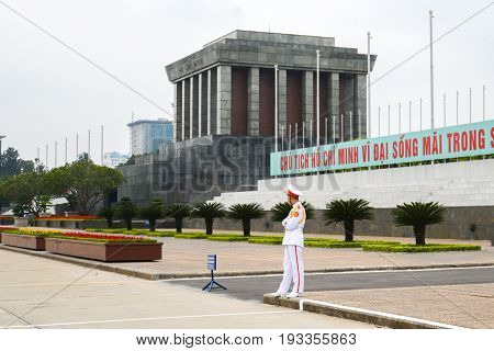 Hanoi Vietnam - Feb 20 2017 : Ho Chi Minh mausoleum with guard in the foreground. Chu Tich means President or Leader.