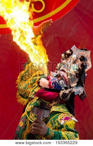 Bangkok Chinese New Year Chinese Opera actor perform spitting fire in the traditional face-changing.