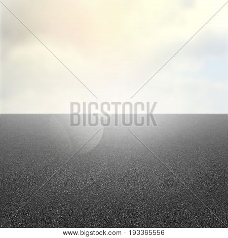 Asphalt road under cloud sky and sun