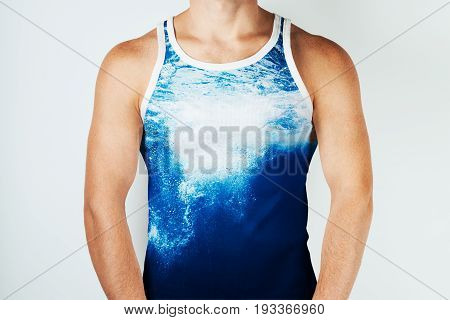 Young man wearing tank top over white background