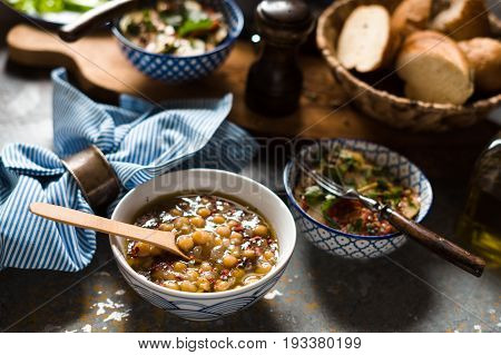 Chickpea soup  Revithia and vegetable stew Briam on the stone background horizontal