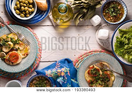 Chickpea soup  Revithia and vegetable stew Briam on the white table top view horizontal