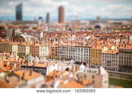 Aerial cityscape view with beautiful old buildings and skyscrapers in Lyon city. Tilt-shift image technic