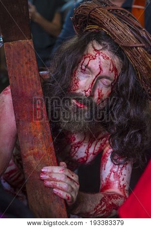 JERUSALEM - APRIL 14 : Christian pilgrim re-enact the crucifixtion of Jesus along the Via Dolorosa in Jerusalem during Good friday on April 14 2017