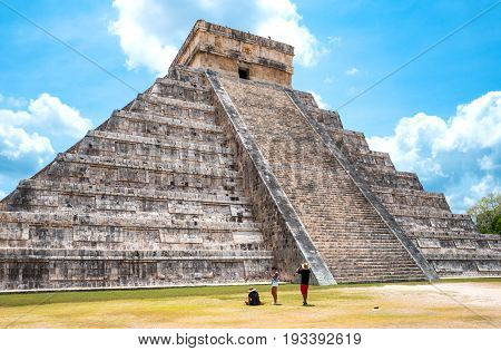 Chichen Itza Mexico - April 18 2016: Archaeological site tousists under the imposing Castle ( El Castillio)