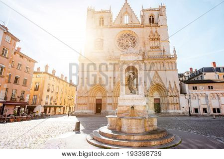 View on the saint Johns cathedral with the statue of Jesusd uring the sunrise in the old town of Lyon city
