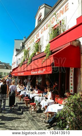 PARIS , France- June 01, 2017: View of typical cafe Au Cadet de Gascognelocated in Montmartre area , one of among most popular destinations in Paris, Au clairon de chasseur is a typical cafe.