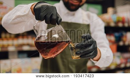 Glass Dripper With Brewed Tea Close-up. Tea Tasting With A Dripper And Kettles Shallow Focus