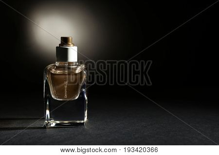 Perfume bottle on dark background