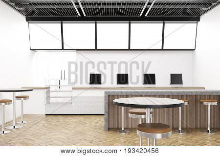 Modern cafe interior with round tables and chairs. Tablet computers on a counter. Marble and wooden bar stand a row of stools. Black ceiling. 3d rendering mock up