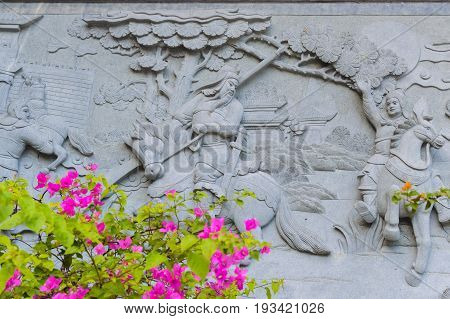 Fragment of China temple architecture and beauty flowers on foreground