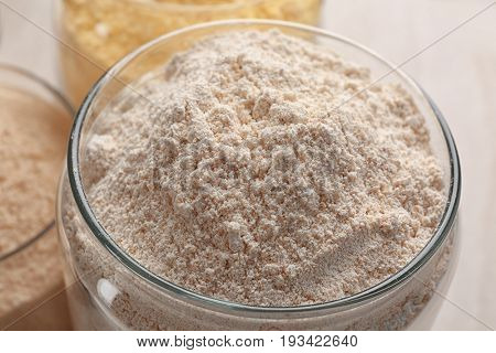 Glass jar with rye flour, closeup