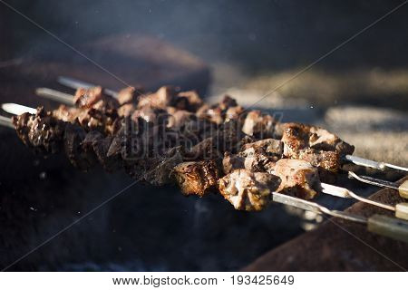 Closeup Of Some Meat Skewers Being Grilled In A Barbecue