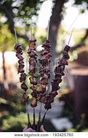Closeup Of Some Meat Skewers Being Grilled In A Barbecue