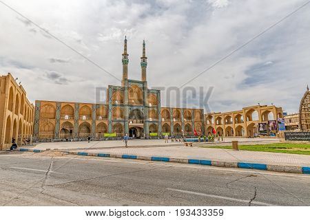 YAZD, IRAN - MAY 5, 2015: Life on the square in front of Amir Chakhmaq Complex in old city.