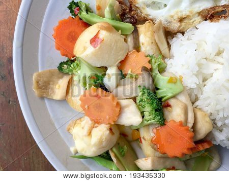 Mixed Fried Vegetable Tofu With Rice And Fried Egg In White Dish On Wooden Background. Vegetarian Fo