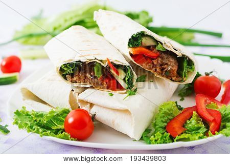 Burritos Wraps With Minced Beef And Vegetables On A Light Background.