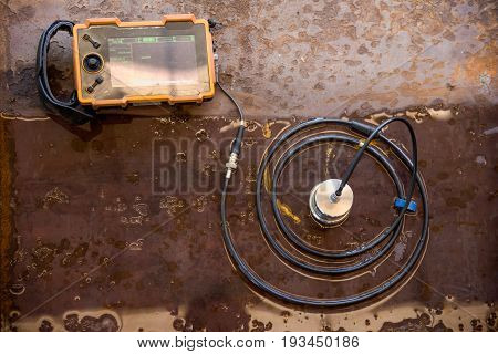 Ultrasonic test to detect imperfection or defect of steel plate in factory NDT Inspection.