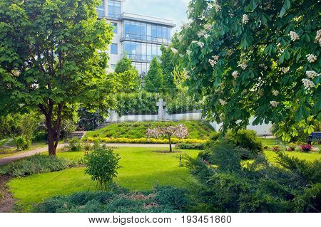 Garden with cross near Marfo-Mariinsky Convent. Moscow Russia.