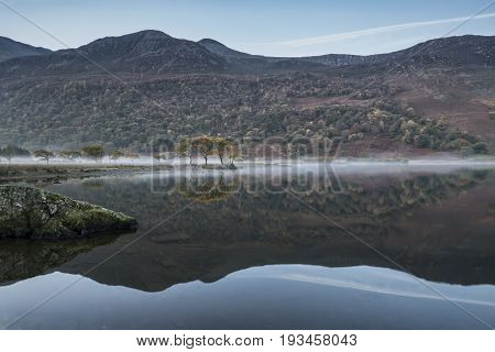 Stunning Winter Foggy Sunrise On Crummock Water In Lake District England