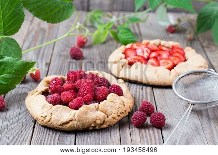 Berry Tart. Galette with summer berries on a wooden background
