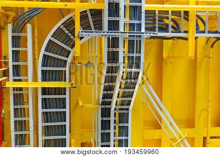 Cable tray with electrical wiring arrange on ceiling at offshore platform.